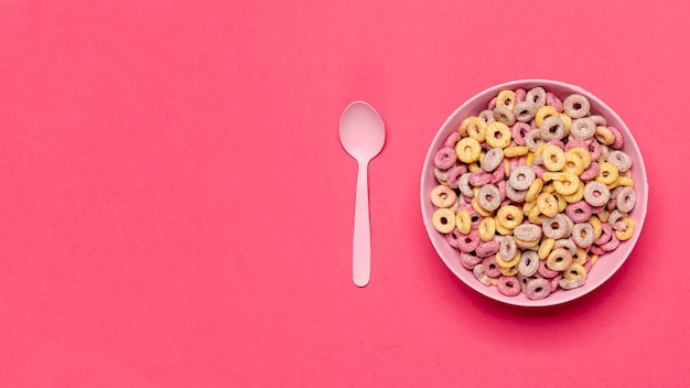 Bowl of cereal fruit loops with spoon