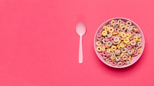 Bowl of cereal fruit loops with spoon