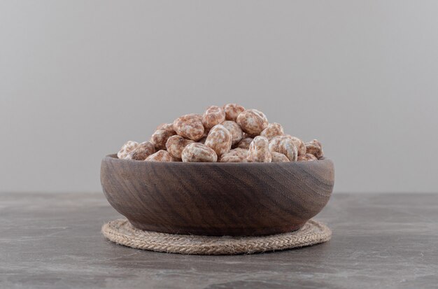 A bowl of confectionery on the marble surface