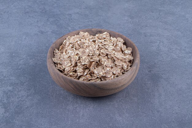 A bowl of flavorful muesli , on the marble background. High quality photo