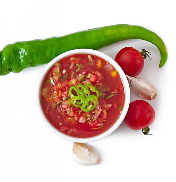 Free photo bowl of fresh salsa dip isolated on white