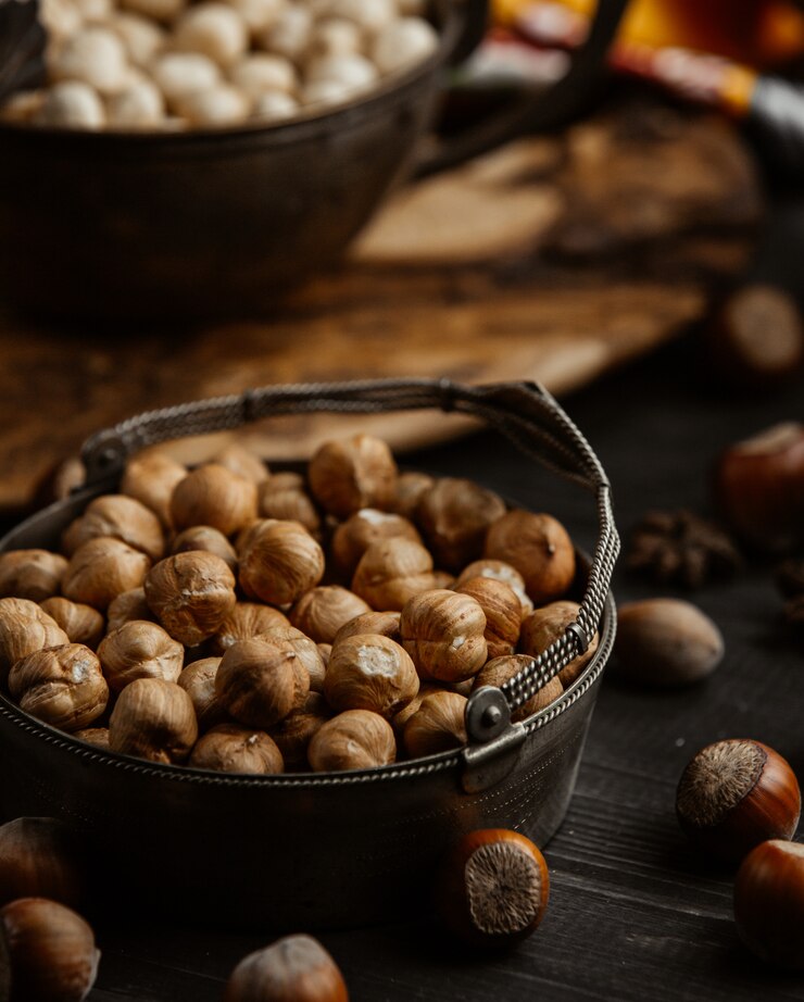 Free Photo a bowl of hazelnut with skin