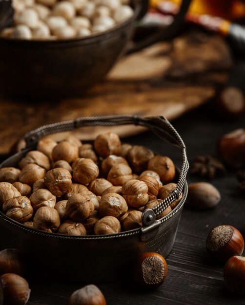 a bowl of hazelnut with skin