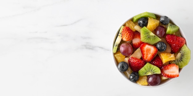 Free photo bowl of healthy fruit copy space