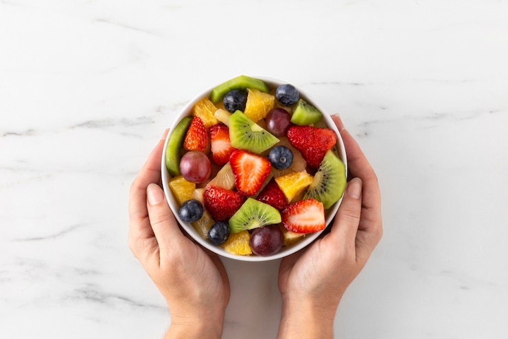 Free Photo bowl of healthy fruit top view