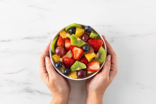 Bowl of healthy fruit top view