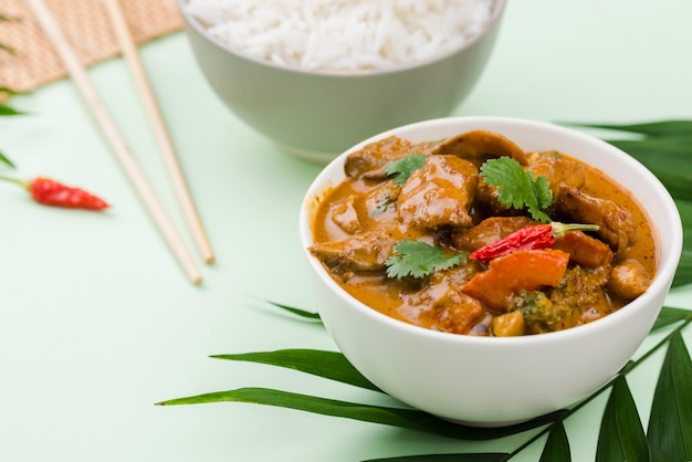 Free photo bowl of homemade stew and chopsticks