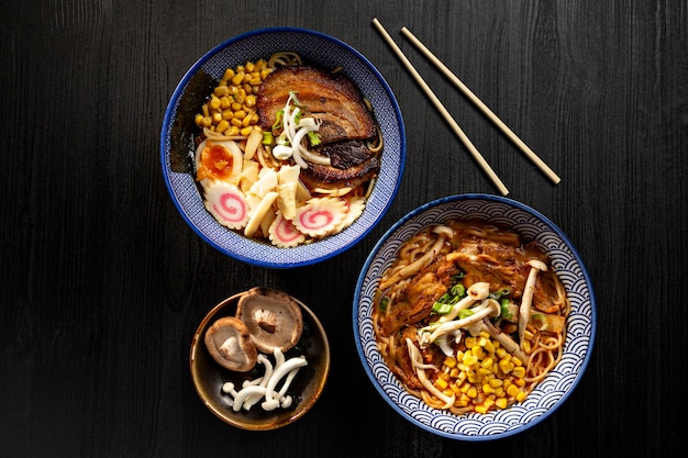 Bowl of japanese miso ramen soups on dark surface viewed from above. japanese noodles.