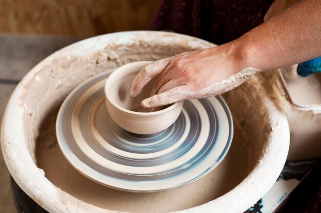 bowl made from clay on a potter's wheel