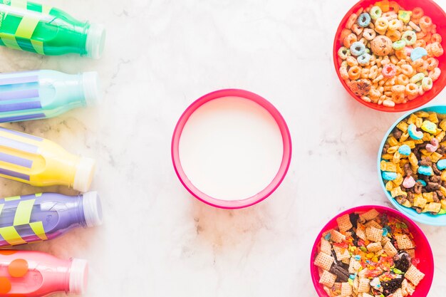 Bowl of milk with cereals on table 