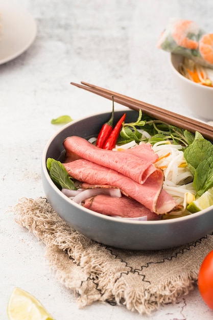 Bowl of noodles with ham and shrimp