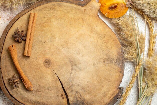 Bowl of palm with star anises and cinnamon sticks around