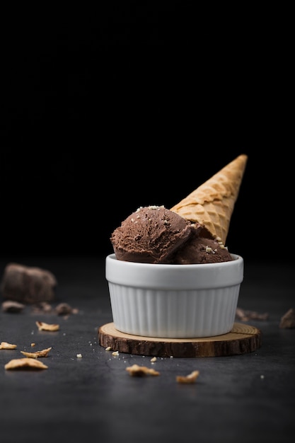 Bowl served with chocolate ice cream scoops and cone