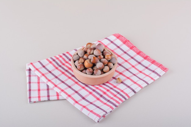 Bowl of shelled organic hazelnuts placed