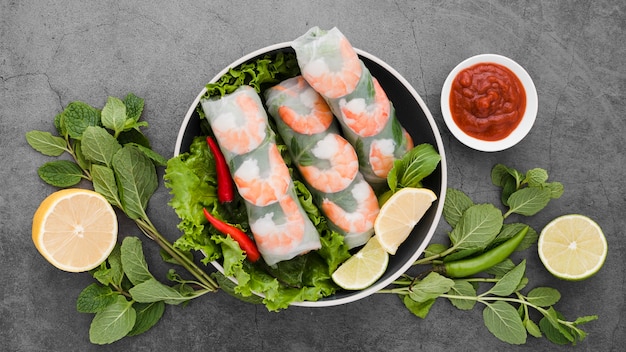 Bowl of shrimp rolls with mint and lemon