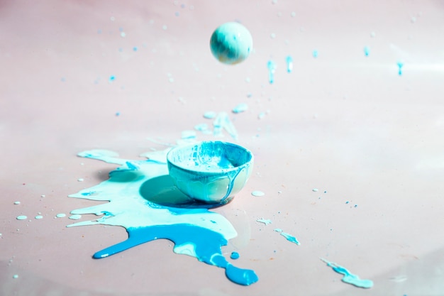 Bowl with blue paint splash