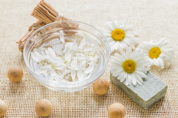 Bowl with camomile petals and camomile