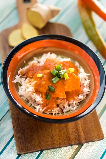 Bowl with curry on board