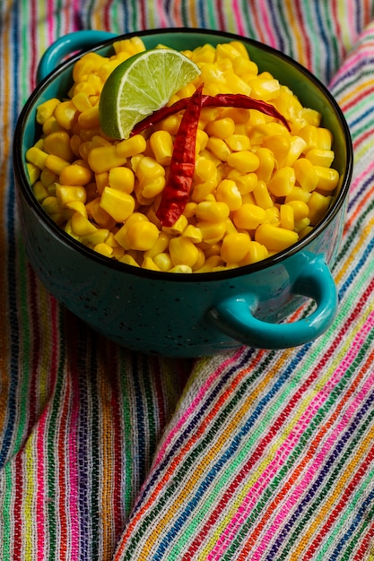 Bowl with delicious esquites high angle