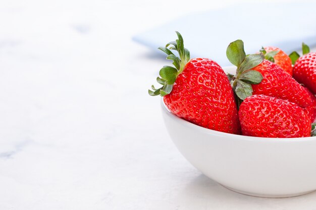 Bowl with fresh strawberries