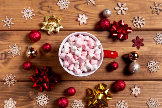 Bowl with marshmallows and christmas decorations