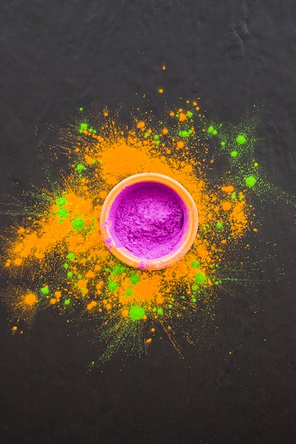 Bowl with purple powder on table