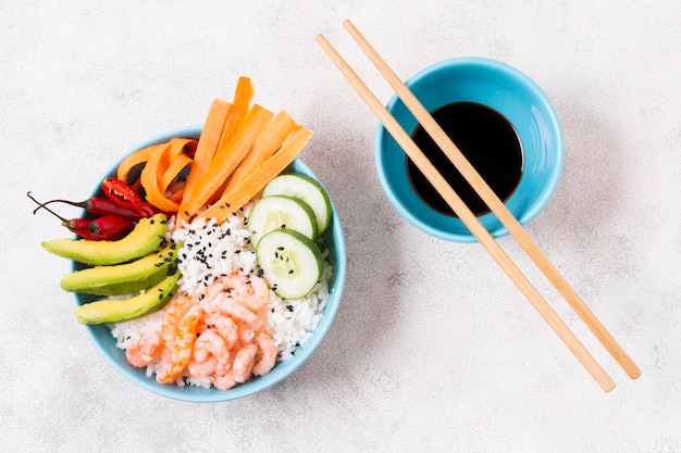 Bowl with rice and vegetables with soya souce