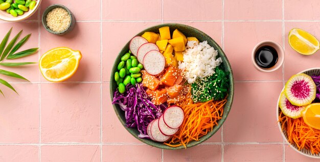 Bowl with salmon rice and fresh vegetables poke top view Banner