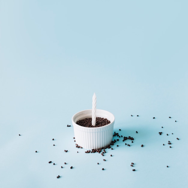 Bowl with sprinkles and candle