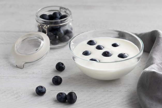 Bowl with yogurt and blueberries high angle