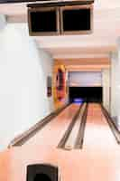 Free photo bowling alley lanes with wooden floor