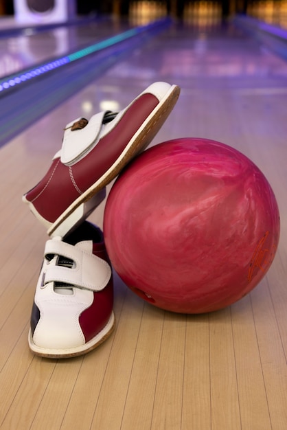 Bowling balls and shoes arrangement