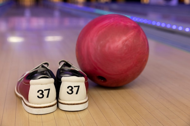 Bowling balls and shoes arrangement