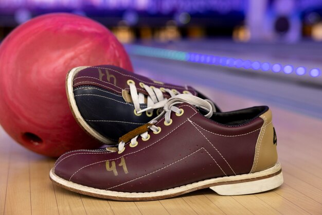 Bowling balls and shoes arrangement