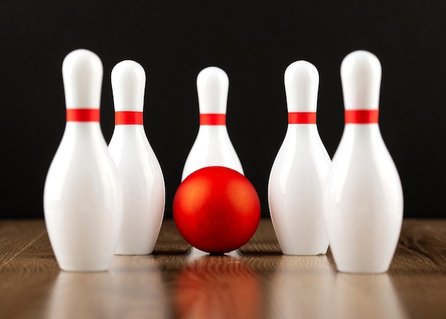 Free photo bowling pins and ball arrangement