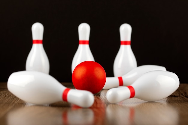 Free photo bowling pins and ball arrangement