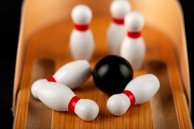 Free photo bowling pins and ball arrangement