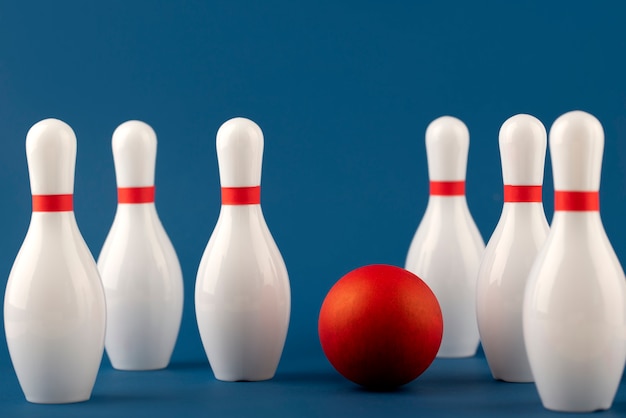 Free photo bowling pins and ball arrangement