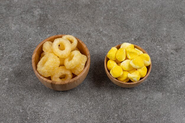 Bowls of candies and sweets on marble.