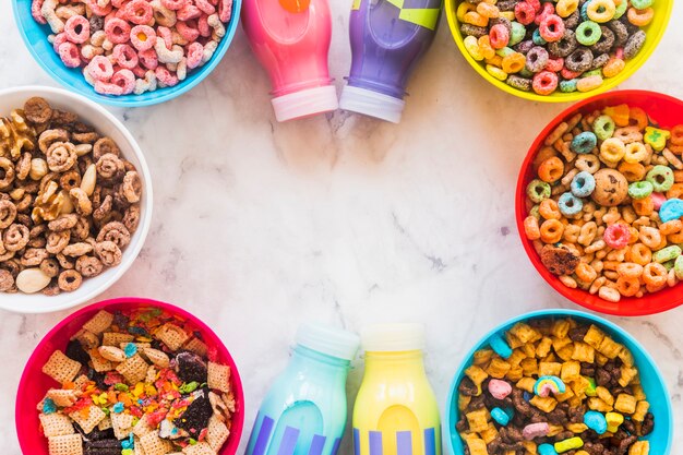 Bowls with cereals and bottles 