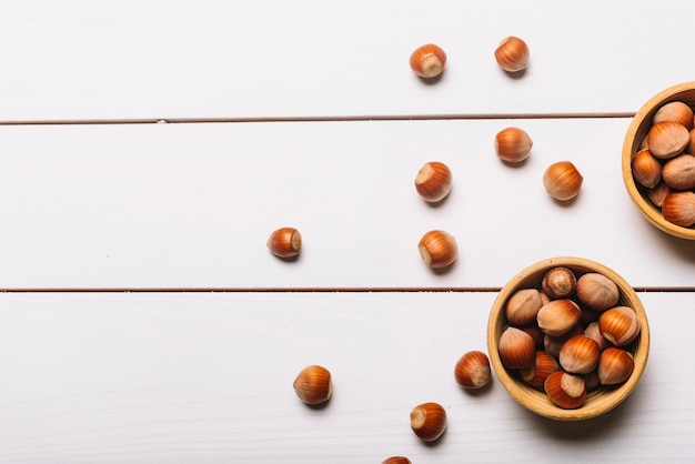 Bowls with nuts on table