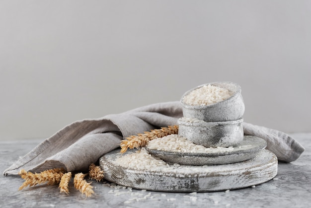 Free photo bowls with rice and cloth arrangement