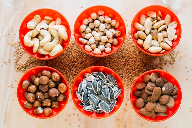 Free photo bowls with various seeds and nuts