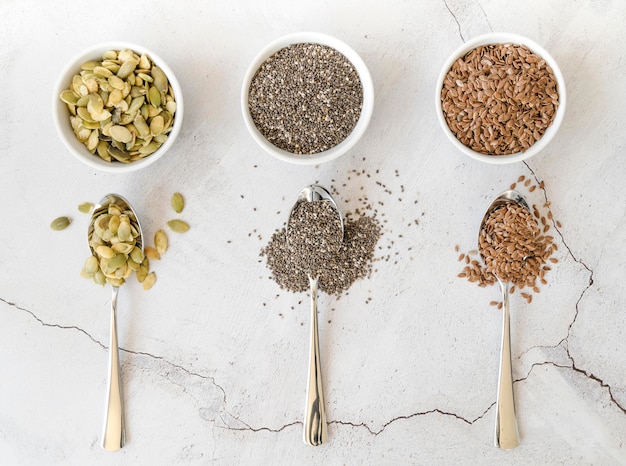 Bowls with various seeds and spoons