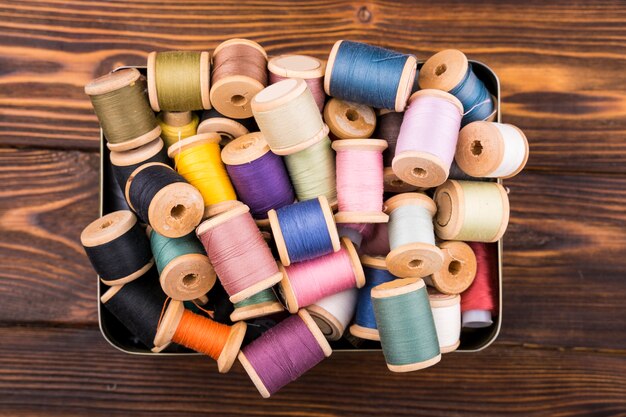 Box of colorful thread spools