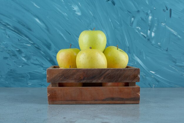 A box of fresh apples , on the marble background. High quality photo