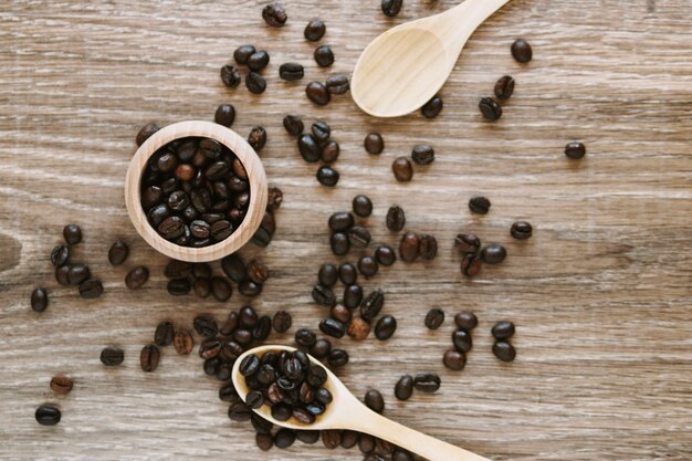 Box with coffee beans and spoons