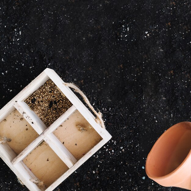 Box with seeds and pot