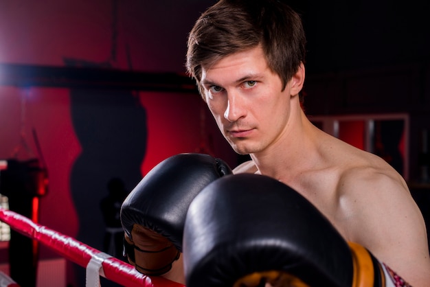 Boxer boy posing at the gym