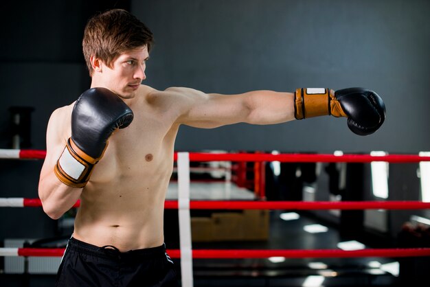 Boxer boy posing at the gym